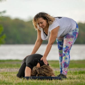 Our Founder, Hannah Davis, offering a safe touch assist with a client.